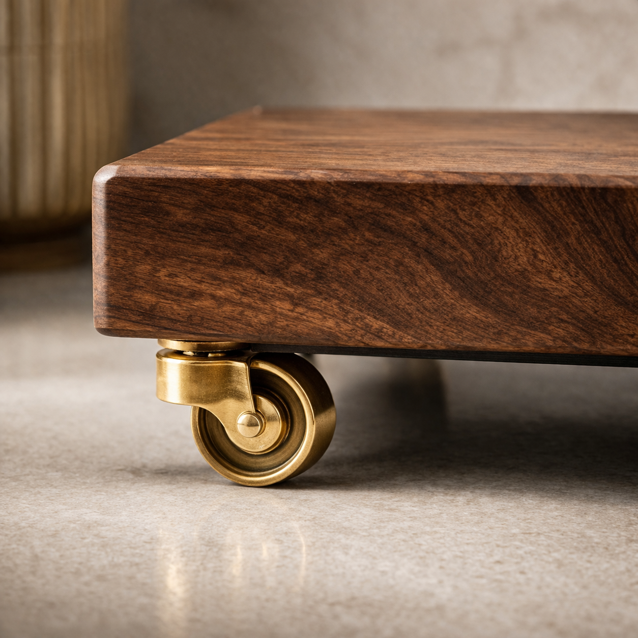 Wooden table with a brass caster wheel on a neutral background