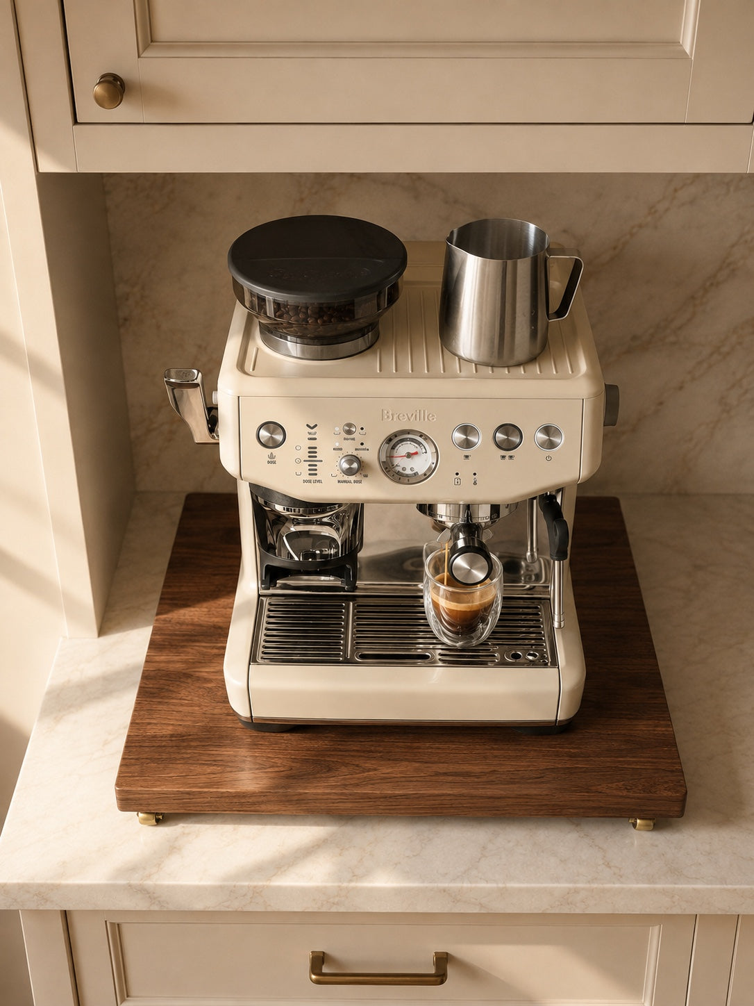 Cream Breville espresso machine viewed from above on The Press walnut platform