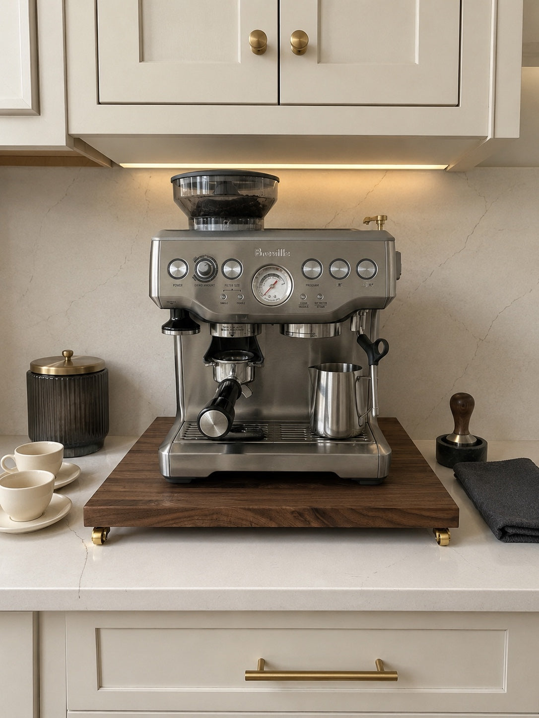 Front view of a stainless Breville espresso machine on The Press walnut rolling tray