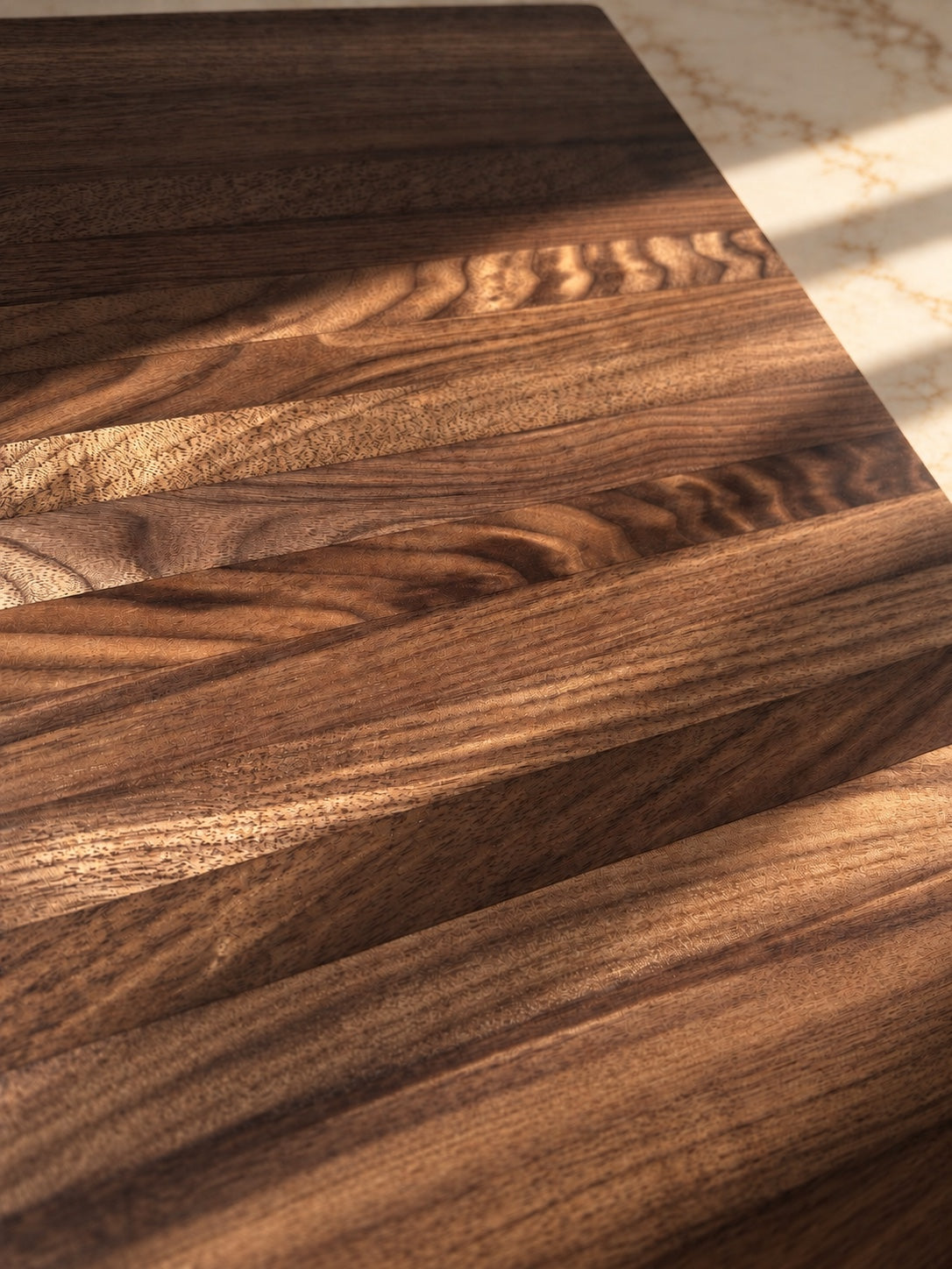 Close-up of the American walnut grain on The Press espresso machine tray
