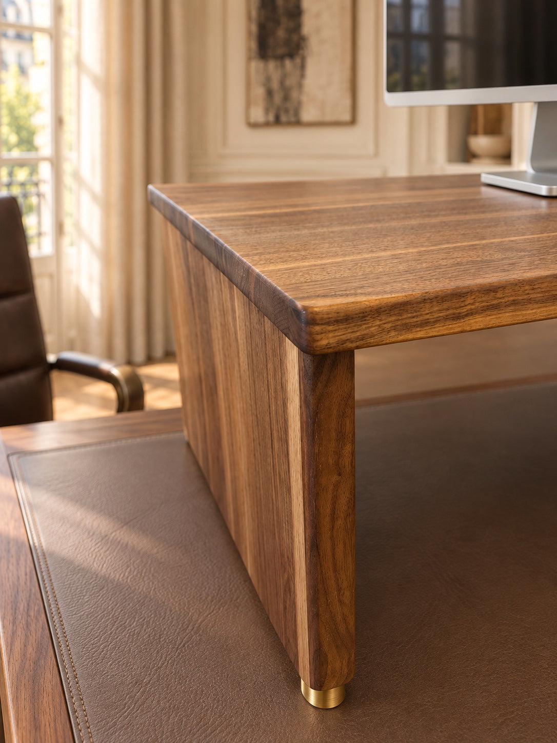 Rounded front corner and full walnut side panel of The Archive